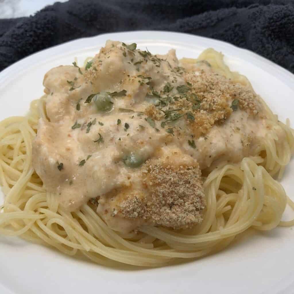 Creamy Chicken Casserole is an easy comfort food recipe. You can use rotisserie chicken to make it even easier. #ChickenRecipes #ComfortFood #CreamyChickenPasta #EasyDinners 