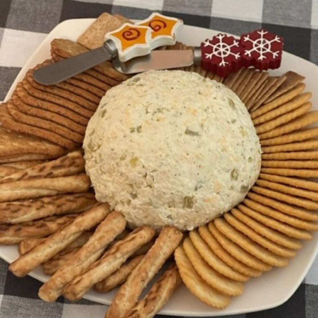 Green Chile Cheese Ball is a delicious party appetizer. It is creamy and flavorful. This cheese ball is perfect for New Year's Eve, Super Bowl parties-any get together. #CheeseBallRecipes #GreenChile #CheeseSpreads #PartyFood