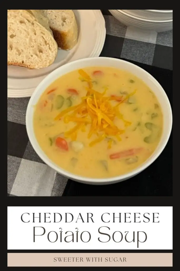 Cheddar Cheese Potato Soup is a delicious homemade soup that is thick and cheesy. You will love this comfort food recipe. #HomemadeSoup #SoupRecipes #CheddarCheeseSoup #CreamyVegetableSoup #ComfortFood