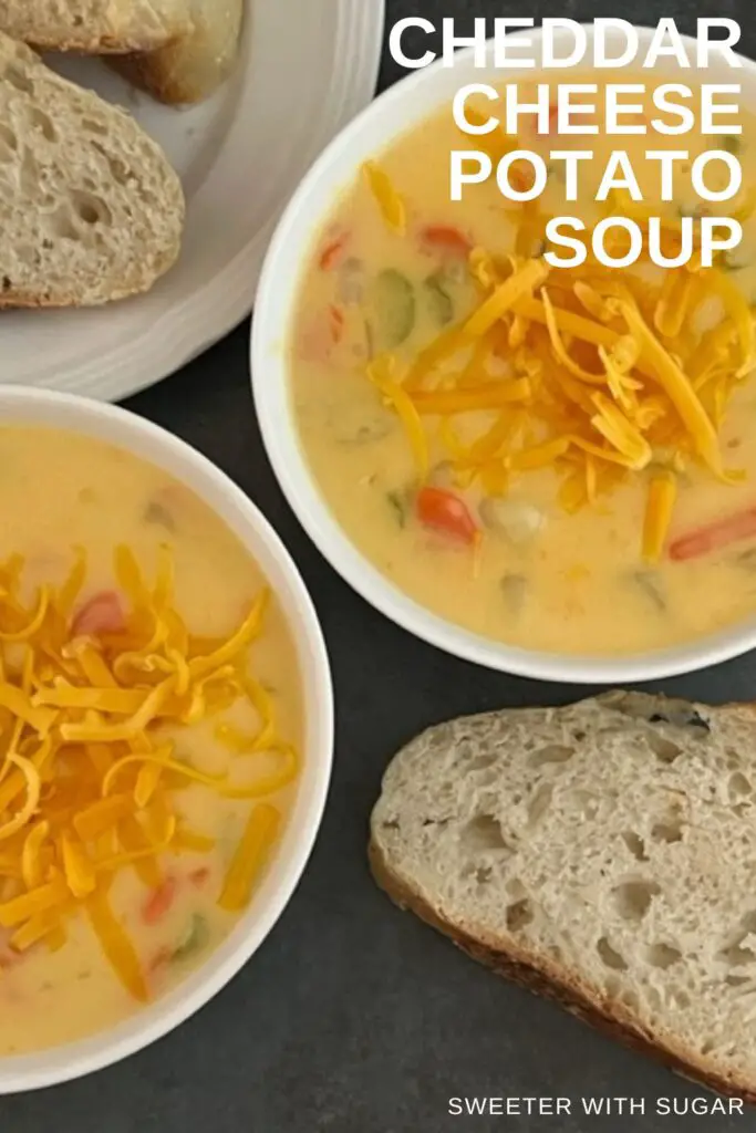 Cheddar Cheese Potato Soup is a delicious homemade soup that is thick and cheesy. You will love this comfort food recipe. #HomemadeSoup #SoupRecipes #CheddarCheeseSoup #CreamyVegetableSoup #ComfortFood