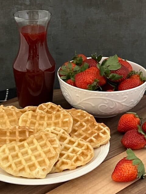 Strawberry Syrup is simple to make and tastes great on pancakes, waffles and French toast. Homemade syrup tastes best! #HomemadeSyrup #Syrup #Condiments #StrawberrySyrup #Strawberry #BreakfastRecipes #BreakfastSyrup