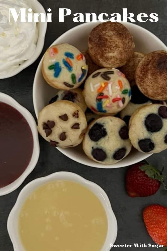 Mini Pancakes are a fun and yummy breakfast idea you can eat with your hands. They are quick to make-you bake them all at once. This is an easy breakfast recipe. #Pancakes #BakedPancakes #EasyRecipes #KidFriendly #FunBreakfastIdeas