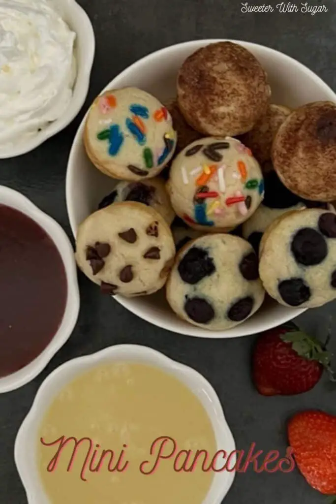 Mini Pancakes are a fun and yummy breakfast idea you can eat with your hands. They are quick to make-you bake them all at once. This is an easy breakfast recipe. #Pancakes #BakedPancakes #EasyRecipes #KidFriendly #FunBreakfastIdeas