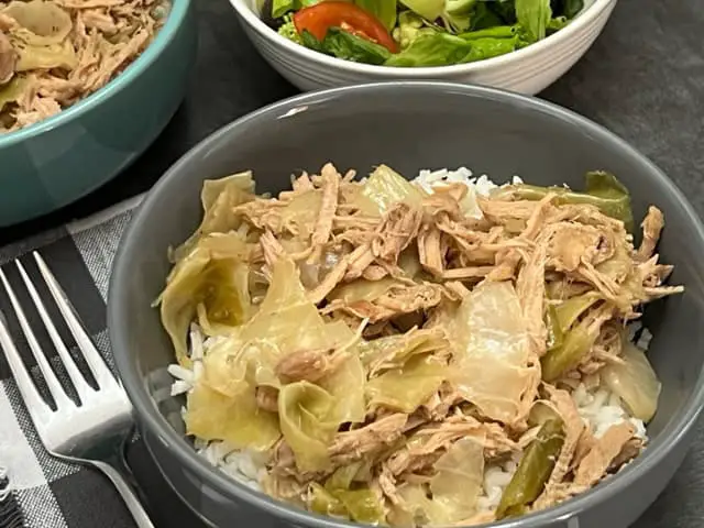 Kalua Pork is a simple slow cooker dinner recipe that will remind you of a Hawaiian Luau. #Pork Recipes #EasyDinner #SlowCooker #WeeknightDinners #KaluaPork