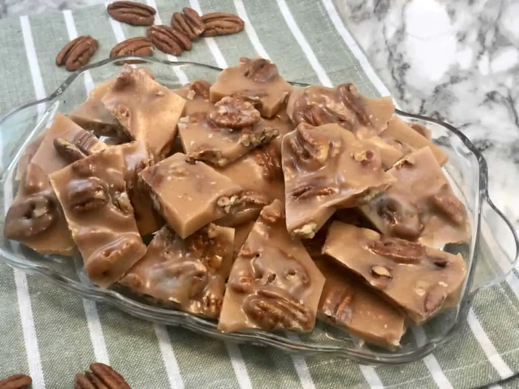 Pecan Brittle is a favorite toffee recipe for Christmas. The buttery toffee covering the yummy pecans makes this recipe delicious. Homemade candy is fun to make and give as holiday gifts. #Christmas #Thanksgiving #HomemadeCandy #ToffeeRecipes #CandyRecipes #Pecans #GiftIdeas #NeighborGifts