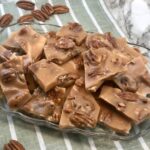 Pecan Brittle is a favorite toffee recipe for Christmas. The buttery toffee covering the yummy pecans makes this recipe delicious. Homemade candy is fun to make and give as holiday gifts. #Christmas #Thanksgiving #HomemadeCandy #ToffeeRecipes #CandyRecipes #Pecans #GiftIdeas #NeighborGifts