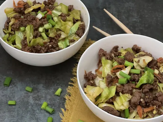 Egg Roll in a Bowl is a one pan dinner recipe with cabbage, carrots, green onion ground pork and seasonings. This recipe is simple and delicious.#EggRolls #OnePanMeals #AsianRecipes #EasyDinners