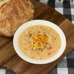 Cheesy Chicken Chowder is an easy slow cooker meal. It is thick and creamy. It is filled with chicken and vegetables. #Chowder #SlowCooker #SoupRecipes #CheesySoup #CrockPotSoup #CreamyVegetableSoup