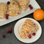 Cranberry Orange Scones are an easy breakfast for the holidays. They are filled with cranberry and orange flavors. They are crispy and flaky. #Scones #Cranberry #Orange #BreakfastRecipes #HolidayRecipes #BreakfastIdeas