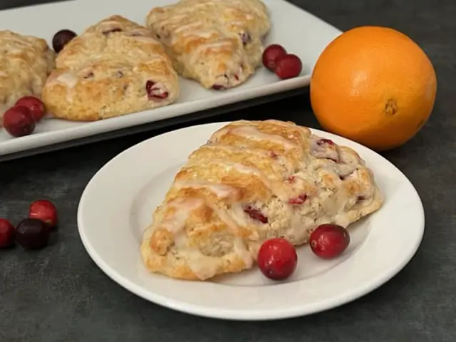 Cranberry Orange Scones are an easy breakfast for the holidays. They are filled with cranberry and orange flavors. They are crispy and flaky. #Scones #Cranberry #Orange #BreakfastRecipes #HolidayRecipes #BreakfastIdeas