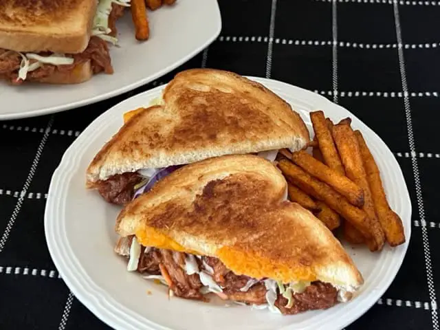 Pulled Pork Grilled Cheese is a simple recipe made with barbecue pulled pork, grilled bread covered in melty cheese. You can even use leftover barbecue pulled pork. #BarbecuePulledPork #GrilledCheese #Sandwiches #EasyDinnerRecipes #PorkRecipes