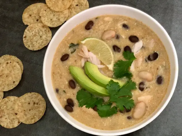 Green Chile Chicken Enchilada Soup is the quickest soup to make. It is full of flavor and good ingredients. #SoupRecipes #EnchiladaSoup #MexicanRecipes #QuickDinnerIdeas #WeeknightDinnerRecipes #RotisserieChickenReipes