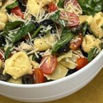 Tortellini Salad is a cold pasta salad filled with cheese tortellini, spinach, tomatoes, basil and more covered in a delicious dressing. #Tortellini #PastaSalads #SideRecipes #FourthOfJuly #BBQRecipes