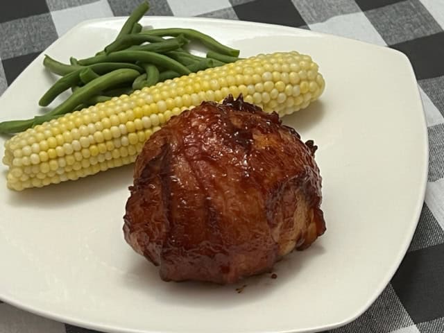 Onion Bombs are a fun dinner idea you will love. The flavorful meat inside the onion wrapped in bacon is delicious! #OnionBombs #StuffedOnions #GrillingRecipes #BeefRecipes