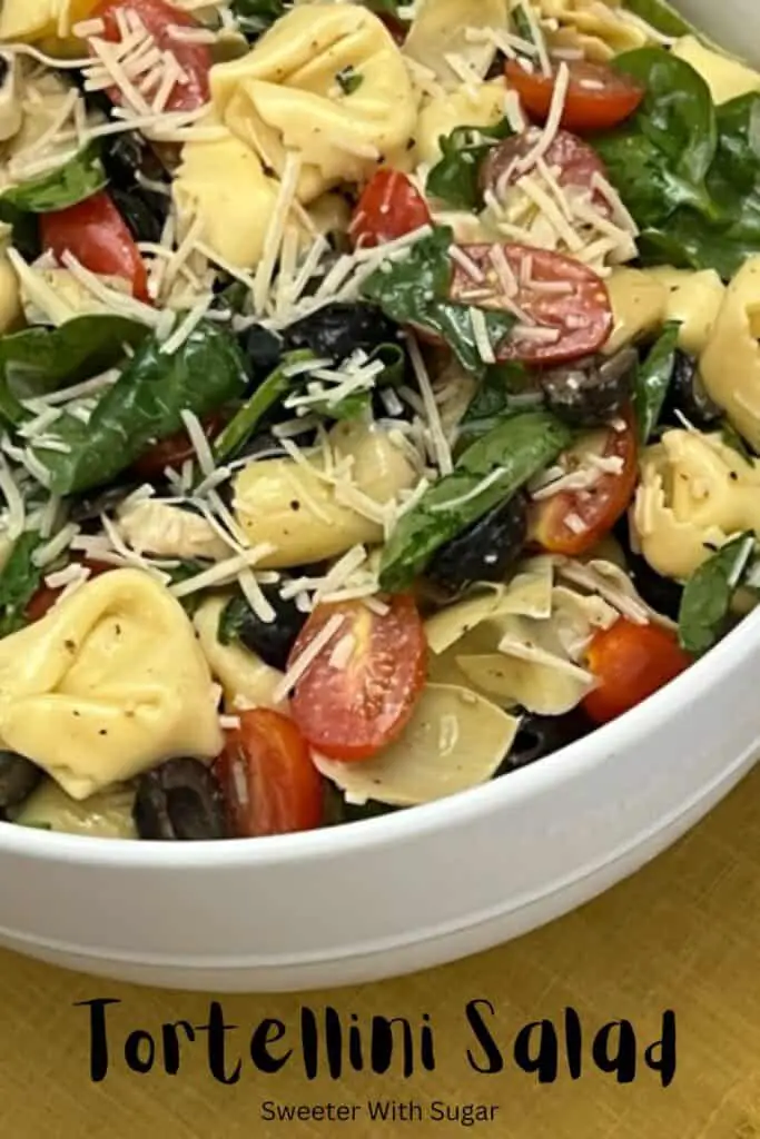 Tortellini Salad is a cold pasta salad filled with cheese tortellini, spinach, tomatoes, basil and more covered in a delicious dressing. #Tortellini #PastaSalads #SideRecipes #FourthOfJuly #BBQRecipes 