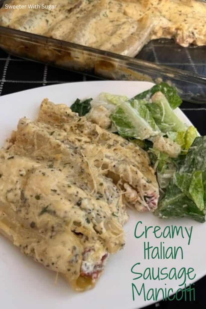 Creamy Italian Sausage Manicotti is a delicious manicotti recipe filled with a sausage mixture and topped with a creamy white sauce. You will love this recipe. #Manicotti #ItalianSausage #FilledPasta #ItalianRecipes #DinnerIdeas #FamilyRecipes