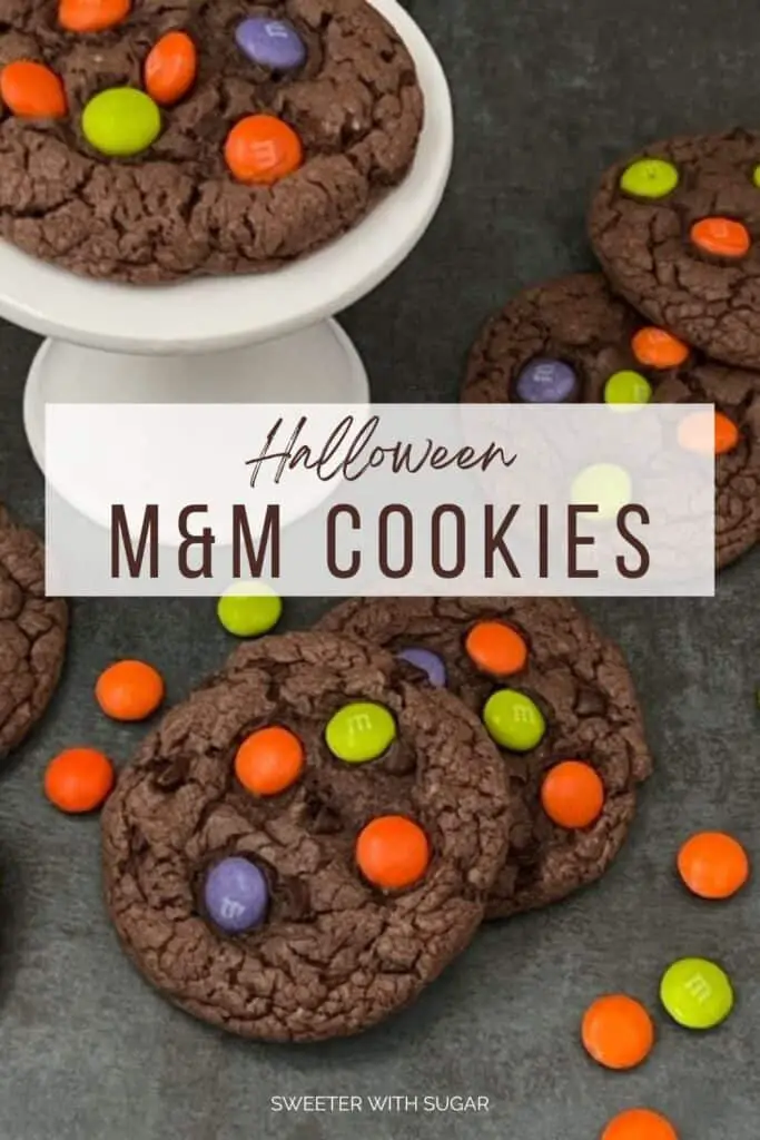 Halloween M & M Cookies are super easy to make. They are a yummy soft chocolate cookie topped with M & M's Ghoul Mix plain M & M's. They are perfect for Halloween. #Cookies #M&Ms #ChocolateCookies #CakeMixCookies #M&MsGhoulMix #EasyCookieRecipe 