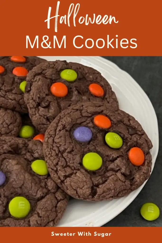 Halloween M & M Cookies are super easy to make. They are a yummy soft chocolate cookie topped with M & M's Ghoul Mix plain M & M's. They are perfect for Halloween. #Cookies #M&Ms #ChocolateCookies #CakeMixCookies #M&MsGhoulMix #EasyCookieRecipe 