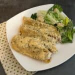 Creamy Italian Sausage Manicotti is a delicious manicotti recipe filled with a sausage mixture and topped with a creamy white sauce. You will love this recipe. #Manicotti #ItalianSausage #FilledPasta #ItalianRecipes #DinnerIdeas #FamilyRecipes