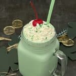 Copycat McDonald's Shamrock Shake is the perfect blend of vanilla ice cream and mint flavor. This shake recipe makes a smooth and creamy dessert beverage. #CopycatMcDonaldsShamrockShake #CopycatRecipes #ShamrockShake #MintShake #StPatricksDayRecipes ##Milkshakes