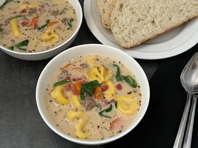 Creamy Italian Sausage Tortellini is an easy soup recipe filled with veggies, ground Italian sausage and cheese tortellini. You will love this homemade soup. #SoupRecipes #ItalianSausage #CheeseTortellini #CreamySoups #DinnerRecipes #HomemadeSoupRecipes