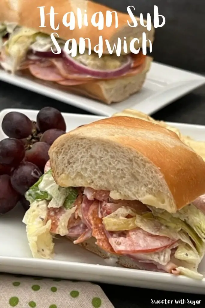 Italian Sub Sandwich is filled with four different deli meats, cheese, veggies and a delicious dressing. It is quick to make and delicious! #Subs #Sandwiches #DeliSandwiches #SubmarineSandwiches #ItalianGrinderSandwiches #Lunches #SandwichRecipes