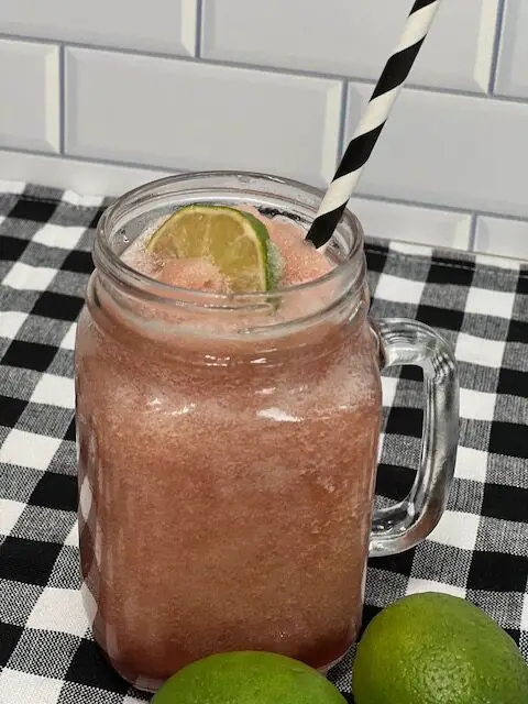 Pomegranate Limeade (or pomegranate limeade slushy) is a refreshing beverage that combines the bright and tart flavors of lime with the sweetness of pomegranate. This beverage recipe is perfect for hot summer days or any time you crave a delicious drink. #SummerDrinks #HolidayBeverages #PomegranateRecipes #LimeRecipes #EasyBeverageRecipes