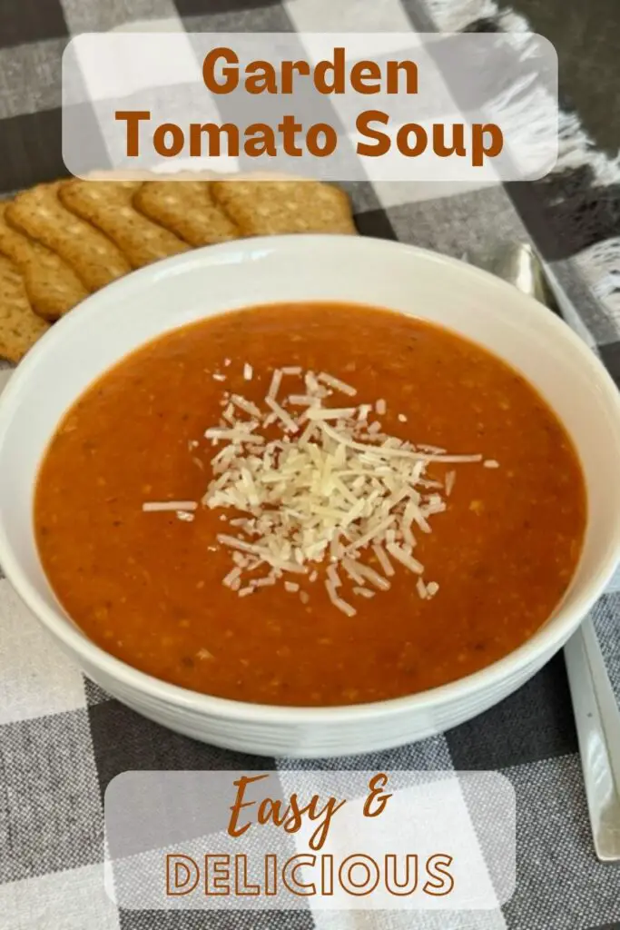 This Garden Tomato Soup recipe is full of ripe, juicy tomatoes, fresh basil and more. It is perfect for chilly evenings or as a side to your favorite grilled cheese sandwich. Homemade tomato basil soup is an all-time favorite comfort food. #GardenRecipes #SoupRecipes #TomatoBasilSoup #ComfortFoodRecipes #TomatoSoup #HowToUseGardenTomatoes