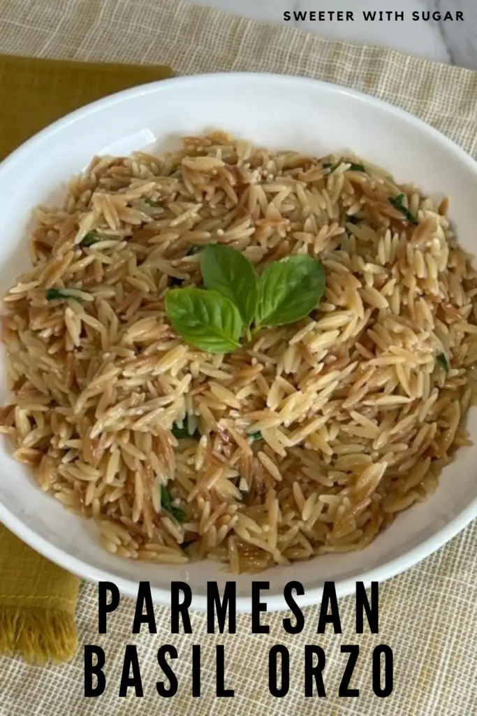 We love orzo pasta-it's just fun! This Parmesan Basil Orzo combines all the right flavors together in a delicious side dish. You can pair this side with chicken, fish, or beef. #OrzoRecipes #EasySides #VersatileSideDishRecipes #PastaRecipes #Basil #ParmesanCheese