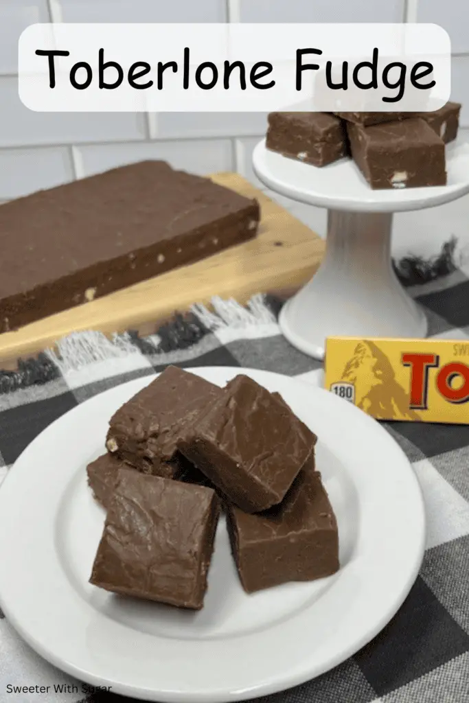 Satisfy your sweet tooth with this decadent Toblerone Fudge recipe! Made with rich chocolate Toblerone candy bars, creamy condensed milk and butter. This easy no-bake dessert is a crowd-pleaser. Perfect for holiday treats, gift-giving, or indulging any time. This fudge is smooth, chocolaty, and loaded with irresistible nougat. #TobleroneFudge #EasyFudgeRecipe #NoBakeDesserts #ChocolateLovers #HolidayTreats #HomemadeFudge #DecadentDesserts
