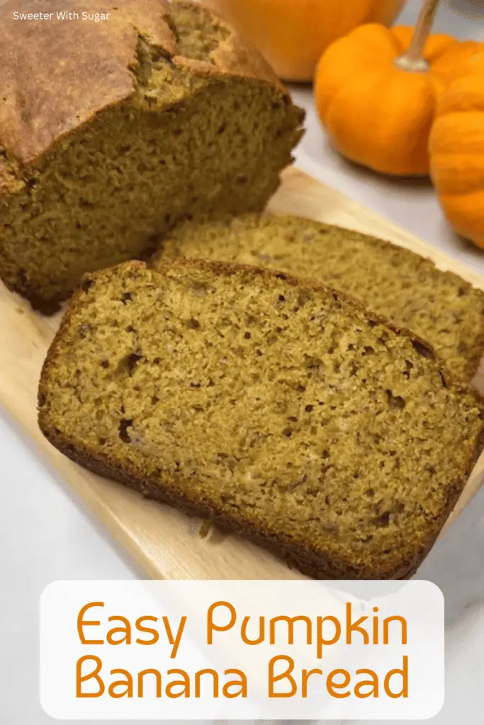 A moist and fluffy loaf of pumpkin banana bread sliced on a wooden cutting board, showing its golden-brown texture with hints of banana and spices. #PumpkinBananaBread #FallBaking #MoistBananaBread #PumpkinSpice #EasyBaking #QuickBread #HomemadeGoodness