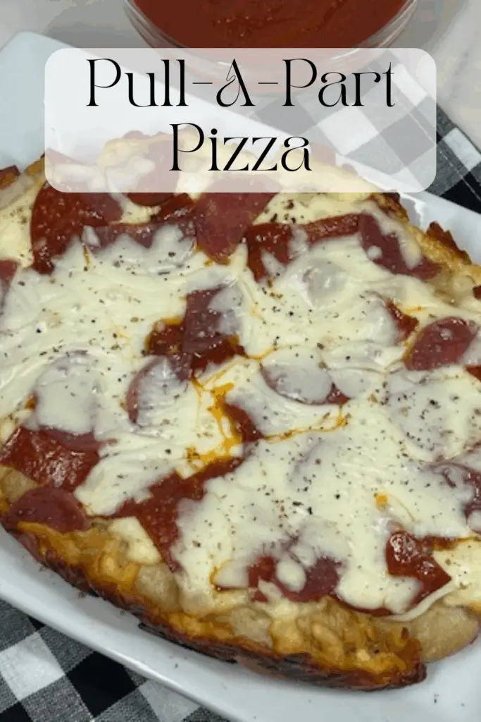 Slow Cooker Pull-Apart Pizza recipe is a fun, cheesy, and crowd-pleasing twist on classic pizza that’s incredibly easy to make! Using Rhodes Roll dough, gooey mozzarella cheese, savory pepperoni, salami, seasonings and your favorite pizza sauce. #PullAPartPizza #SlowCookerRecipes #PizzaNight #HomemadePizza #FamilyFun #EasyPepperoniPizza