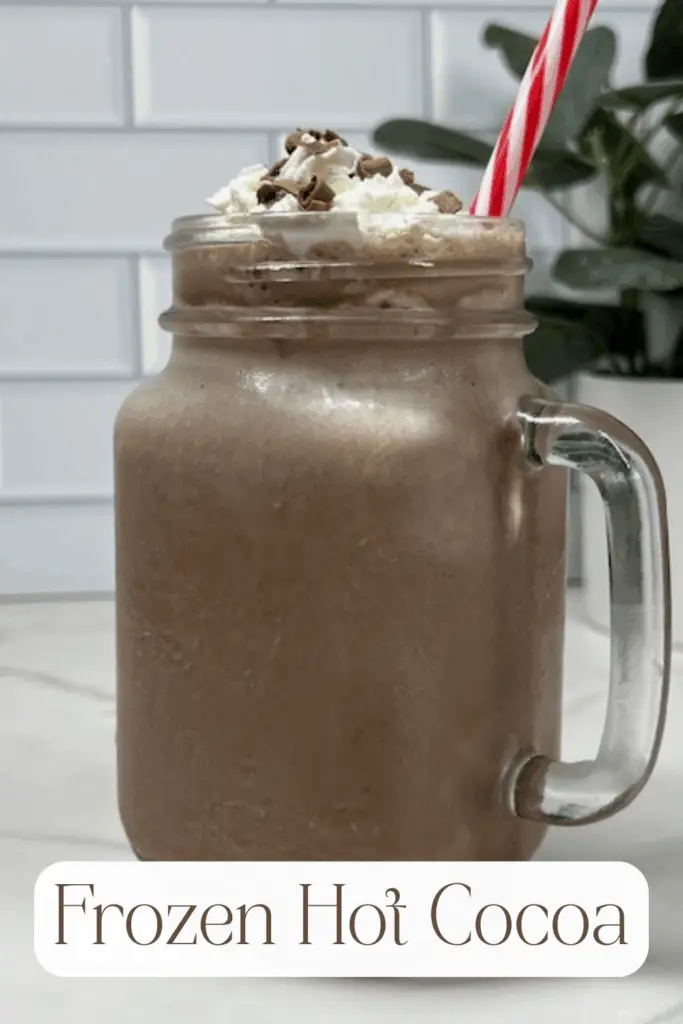 Beat the heat with this Frozen Hot Cocoa recipe – a frosty, chocolatey drink that tastes just like your favorite hot chocolate but in a frosty version! Made with hot cocoa mix, chocolate milk, ice, and topped with whipped cream, this easy frozen hot chocolate recipe is a fun twist on the classic winter drink. Perfect for summer parties, Christmas in July, holiday gatherings, or cozy movie nights, this refreshing frozen cocoa is kid-friendly and budget-friendly. Add whipped cream, chocolate syrup, chocolate curls or marshmallows on top for the ultimate treat. #FrozenHotCocoa #FrozenHotChocolate #SummerDrinks #EasyRecipes #ChocolateRecipes #CopycatRecipes #ChocolateLovers #ColdDrinks #NoBakeDesserts #PartyDrinks