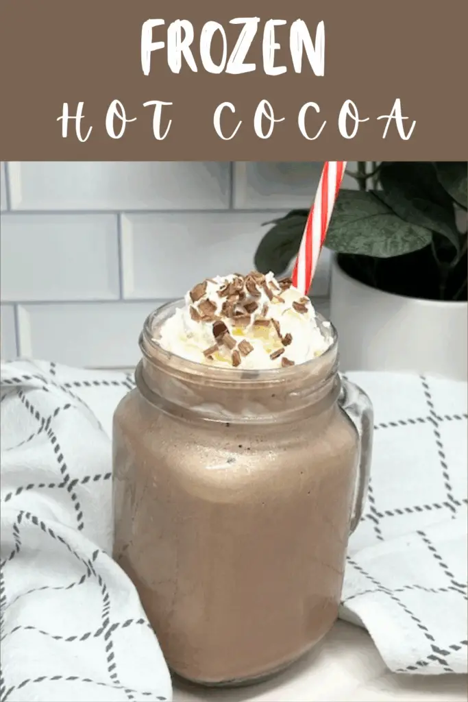 Beat the heat with this Frozen Hot Cocoa recipe – a frosty, chocolatey drink that tastes just like your favorite hot chocolate but in a frosty version! Made with hot cocoa mix, chocolate milk, ice, and topped with whipped cream, this easy frozen hot chocolate recipe is a fun twist on the classic winter drink. Perfect for summer parties, Christmas in July, holiday gatherings, or cozy movie nights, this refreshing frozen cocoa is kid-friendly and budget-friendly. Add whipped cream, chocolate syrup, chocolate curls or marshmallows on top for the ultimate treat. #FrozenHotCocoa #FrozenHotChocolate #SummerDrinks #EasyRecipes #ChocolateRecipes #CopycatRecipes #ChocolateLovers #ColdDrinks #NoBakeDesserts #PartyDrinks