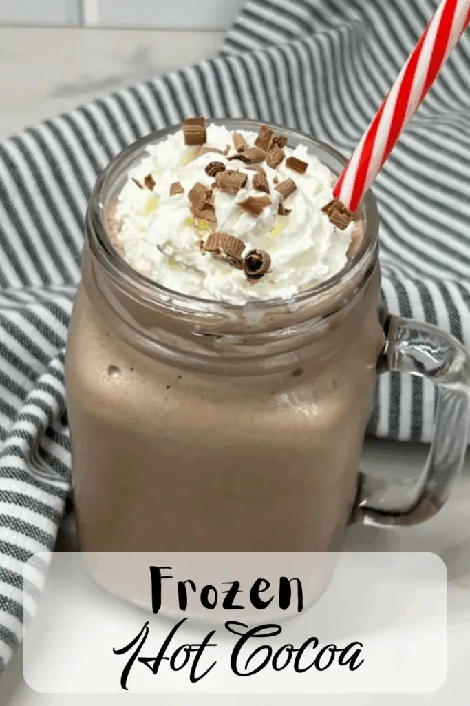 Beat the heat with this Frozen Hot Cocoa recipe – a frosty, chocolatey drink that tastes just like your favorite hot chocolate but in a frosty version! Made with hot cocoa mix, chocolate milk, ice, and topped with whipped cream, this easy frozen hot chocolate recipe is a fun twist on the classic winter drink. Perfect for summer parties, Christmas in July, holiday gatherings, or cozy movie nights, this refreshing frozen cocoa is kid-friendly and budget-friendly. Add whipped cream, chocolate syrup, chocolate curls or marshmallows on top for the ultimate treat. #FrozenHotCocoa #FrozenHotChocolate #SummerDrinks #EasyRecipes #ChocolateRecipes #CopycatRecipes #ChocolateLovers #ColdDrinks #NoBakeDesserts #PartyDrinks