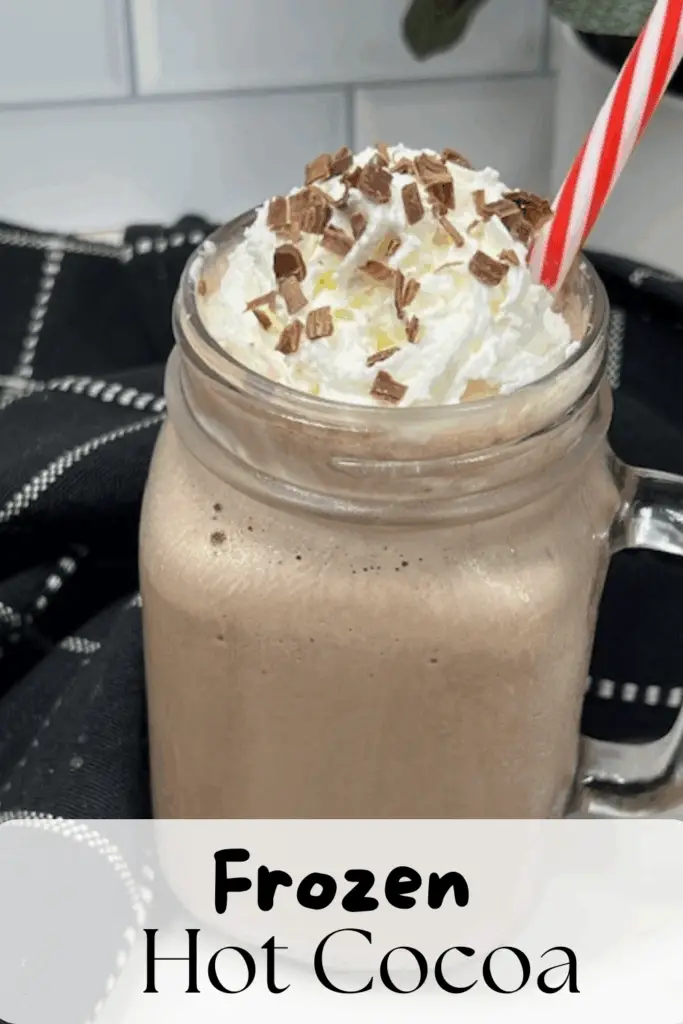 Beat the heat with this Frozen Hot Cocoa recipe – a frosty, chocolatey drink that tastes just like your favorite hot chocolate but in a frosty version! Made with hot cocoa mix, chocolate milk, ice, and topped with whipped cream, this easy frozen hot chocolate recipe is a fun twist on the classic winter drink. Perfect for summer parties, Christmas in July, holiday gatherings, or cozy movie nights, this refreshing frozen cocoa is kid-friendly and budget-friendly. Add whipped cream, chocolate syrup, chocolate curls or marshmallows on top for the ultimate treat. #FrozenHotCocoa #FrozenHotChocolate #SummerDrinks #EasyRecipes #ChocolateRecipes #CopycatRecipes #ChocolateLovers #ColdDrinks #NoBakeDesserts #PartyDrinks