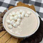 Whether you’re planning a holiday movie night, cozy winter gathering, or a Christmas potluck, this Hot Cocoa Dip is the perfect treat. Learn how to make it ahead of time, how to store it, and how to customize it with toppings like crushed candy canes, mini marshmallows, or chocolate chips.