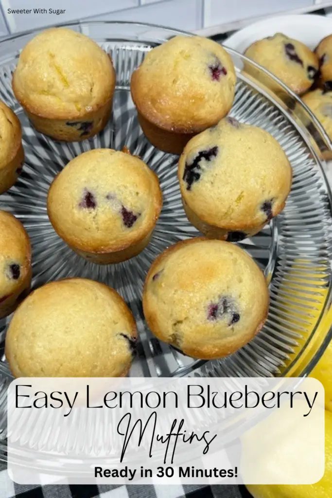 Easy lemon blueberry muffins on a cake plate ready to serve.