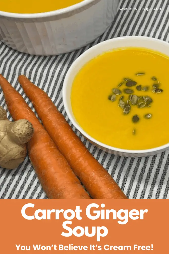 Smooth and velvety orange carrot ginger soup in a bowl with pumpkin seeds. Add a drizzle of sour cream, if desired.