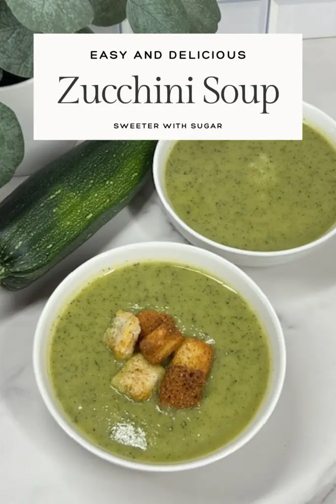Creamy homemade zucchini soup served in a white bowl topped with croutons.