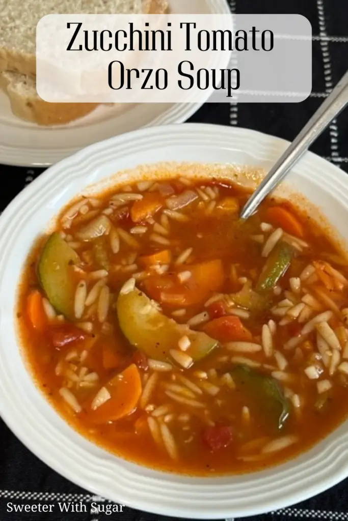 Hearty zucchini tomato orzo soup with tender vegetables and pasta.